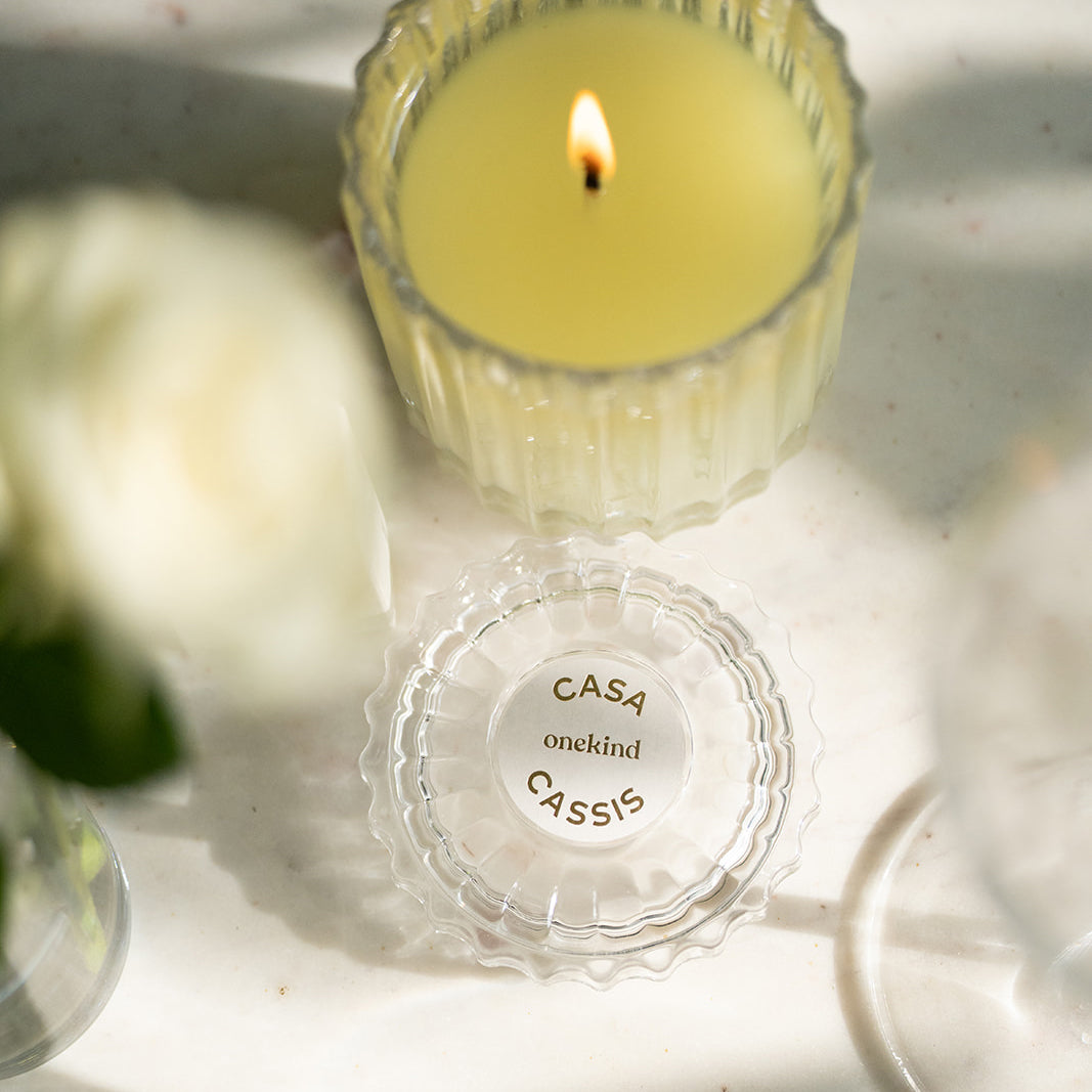 Candle on table with flower
